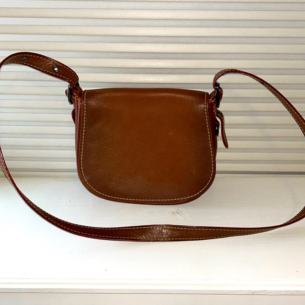 Coach saddle brown cross body bag.  Adjustable strap.  Great condition.